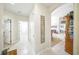 Hallway with tile flooring and decorative wall art leading to dining area at 2308 Bur Oak Ct, Oviedo, FL 32766