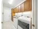 Laundry room with modern washer and dryer at 2308 Bur Oak Ct, Oviedo, FL 32766