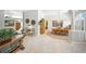 Open-concept living room with tile floors, decorative accents, and a seamless flow to the dining area at 2308 Bur Oak Ct, Oviedo, FL 32766