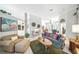 Bright and airy living room with neutral tiling, comfortable seating, and stylish decor at 2308 Bur Oak Ct, Oviedo, FL 32766