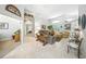 Open concept living room featuring large windows, tile floors, and decorative furnishings at 2308 Bur Oak Ct, Oviedo, FL 32766