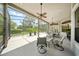The screened patio offers a place to relax and enjoy the beautiful views at 2308 Bur Oak Ct, Oviedo, FL 32766