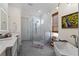 Elegant bathroom features a freestanding tub, walk-in shower, dual sinks, and tasteful decor at 2456 Northumbria Dr, Sanford, FL 32771