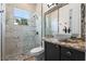 Bathroom featuring a walk-in shower, bowl sink, granite counter and black fixtures at 2456 Northumbria Dr, Sanford, FL 32771