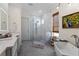 Modern bathroom featuring a walk-in shower, soaking tub, and stylish fixtures at 2456 Northumbria Dr, Sanford, FL 32771