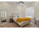 Cozy bedroom featuring a full bed, accent lighting and ample natural light from a window at 2456 Northumbria Dr, Sanford, FL 32771