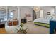 Bedroom featuring a large bed and stylish lighting fixture and access to the lanai at 2456 Northumbria Dr, Sanford, FL 32771