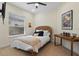 Bedroom featuring a twin bed, natural light from a window and a vintage travel poster at 2456 Northumbria Dr, Sanford, FL 32771