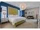 Spacious bedroom with a large bed, decorative lighting, and ample natural light at 2456 Northumbria Dr, Sanford, FL 32771