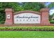 Elegant Buckingham Estates community sign with brick pillars, lush landscaping, and well-maintained surroundings at 2456 Northumbria Dr, Sanford, FL 32771