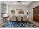Formal dining room with stylish lighting, neutral colors, and seating for eight at 2456 Northumbria Dr, Sanford, FL 32771