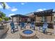 Outdoor living space with a fire pit, pergola, bar, and grill is perfect for entertaining and relaxing at 2456 Northumbria Dr, Sanford, FL 32771