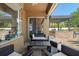 Outdoor patio with a covered seating area, outdoor kitchen, and sliding glass doors to the interior at 2456 Northumbria Dr, Sanford, FL 32771