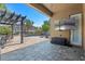 Outdoor patio features a covered seating area, stone flooring, an outdoor television, and a view of the pool at 2456 Northumbria Dr, Sanford, FL 32771