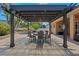 Outdoor patio featuring a dining area with a pergola, and a spa at 2456 Northumbria Dr, Sanford, FL 32771