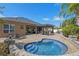 Relaxing backyard featuring a beautiful pool, patio with pergola, and lush landscaping at 2456 Northumbria Dr, Sanford, FL 32771