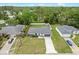Aerial view of a single-Gathering home with a well-maintained lawn and driveway at 2626 Coachman Dr, Deltona, FL 32738