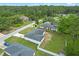 A quiet street with homes tucked into a well-established neighborhood, surrounded by trees at 2626 Coachman Dr, Deltona, FL 32738