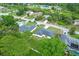 Residential neighborhood with mature trees, manicured lawns, and well-maintained houses at 2626 Coachman Dr, Deltona, FL 32738