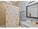 Bathroom showcasing a vanity with a sink and a shower with a floral curtain at 2626 Coachman Dr, Deltona, FL 32738