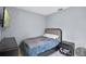 Small bedroom featuring a neutral color scheme and an adjacent nightstand at 2626 Coachman Dr, Deltona, FL 32738