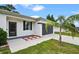 Modern single-story home featuring an attached garage and a well-kept lawn with new landscaping at 2626 Coachman Dr, Deltona, FL 32738