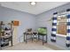 Office with tiled flooring, a desk setup and a window with striped curtains at 2626 Coachman Dr, Deltona, FL 32738