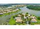 Community aerial shot with lake views, boat docks, and beautiful landscaping and neighborhood at 2631 Captains Ct, Kissimmee, FL 34746