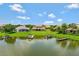 Aerial view showcasing a landscaped backyard, lake access, and boat docks in a tranquil setting at 2631 Captains Ct, Kissimmee, FL 34746