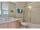 Modern bathroom boasts a vanity, toilet, and shower with glass doors, complemented by stylish fixtures at 2631 Captains Ct, Kissimmee, FL 34746