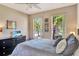 Tranquil bedroom featuring two windows and a view to the outside at 2631 Captains Ct, Kissimmee, FL 34746