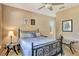 Cozy bedroom with neutral walls, tile flooring, and a comfortable bed at 2631 Captains Ct, Kissimmee, FL 34746