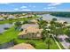 Beautiful home showcasing a large backyard, a private dock, and serene waterfront views at 2631 Captains Ct, Kissimmee, FL 34746