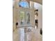 Bright foyer features decorative glass double doors, soaring ceilings, tile floors, and views into the home at 2631 Captains Ct, Kissimmee, FL 34746