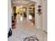 Spacious foyer with tile floors and arches leading to the living spaces of the home at 2631 Captains Ct, Kissimmee, FL 34746