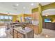 Open kitchen featuring marble countertops, stainless steel appliances, and views of the water at 2631 Captains Ct, Kissimmee, FL 34746