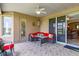 Relaxing covered lanai with ceiling fan and stylish furniture is ideal for outdoor enjoyment at 2631 Captains Ct, Kissimmee, FL 34746