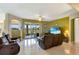 The living room offers access to the outdoor patio through sliding glass doors with a great view at 2631 Captains Ct, Kissimmee, FL 34746