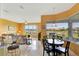 Open-concept area features a breakfast nook and seating with a view of the lake at 2631 Captains Ct, Kissimmee, FL 34746