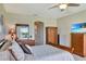 Inviting main bedroom with warm wood furniture, providing an elegant and comfortable personal space at 2631 Captains Ct, Kissimmee, FL 34746