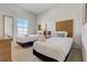Bright bedroom featuring two twin beds with stylish headboards and plush white linens at 2745 Corvette Ln, Kissimmee, FL 34746