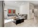 Comfortable living room with neutral furniture, tile flooring, and bright light at 2745 Corvette Ln, Kissimmee, FL 34746