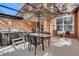 The screened-in patio offers an outdoor dining area and hot tub for relaxing at 2745 Corvette Ln, Kissimmee, FL 34746