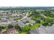 Scenic aerial view of a complex near a lake, featuring a community pool and surrounding greenery at 2893 S Osceola Ave # E6, Orlando, FL 32806