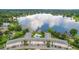 Stunning aerial view showcasing a lakefront building with a pool and serene surroundings at 2893 S Osceola Ave # E6, Orlando, FL 32806