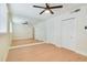Bedroom featuring hardwood floors, a modern ceiling fan, and mirrored closet doors at 2893 S Osceola Ave # E6, Orlando, FL 32806
