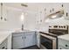 Updated kitchen featuring stainless steel appliances, white cabinets, and new countertops at 2893 S Osceola Ave # E6, Orlando, FL 32806