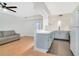 Bright living room with a gray sofa, open to the kitchen with a modern color palette and finishes at 2893 S Osceola Ave # E6, Orlando, FL 32806
