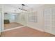 Bright dining space featuring wood floors, a modern lighting fixture and a full wall mirror at 2893 S Osceola Ave # E6, Orlando, FL 32806