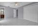 Bedroom features neutral paint and tile flooring, along with a closet and easy access to the bathroom at 300 Florida Pkwy, Kissimmee, FL 34743